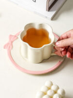 ⁦Set Of 2pcs Ceramic Mug Bow Cute with Saucer - White 280ml⁩ - الصورة ⁦2⁩