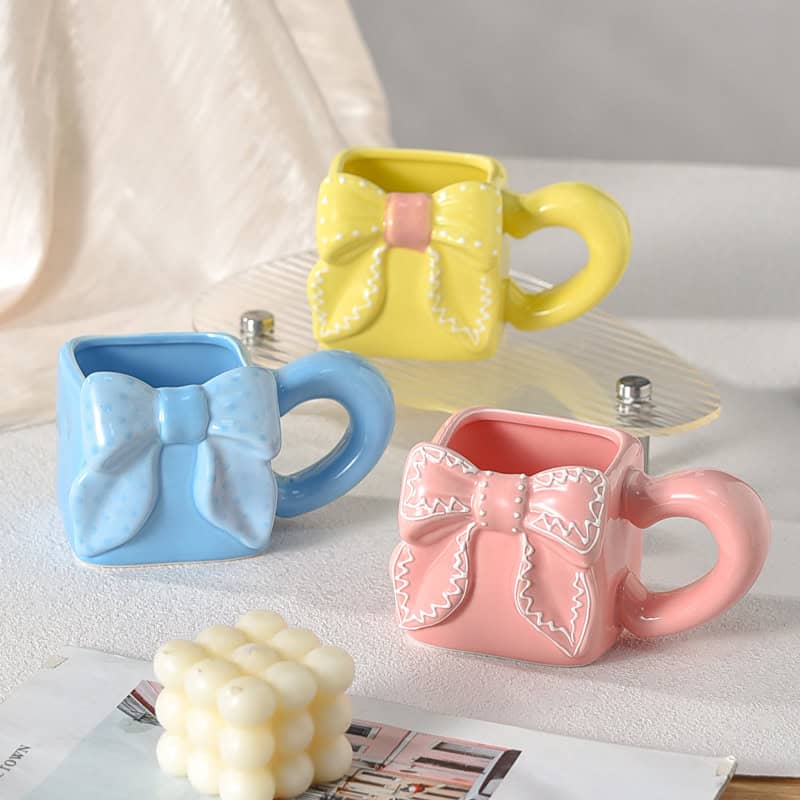 H651053006c5f4560830c2486e127e61fu 1Pc Random - Ceramic Mug Square Bow - 350ml - الصورة 1