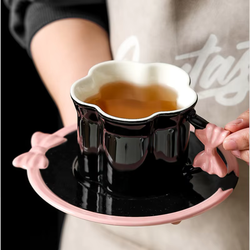 H91cc44d5b5a240ef837c71bbdf262bf6B Set Of 2pcs Ceramic Mug Bow Cute with Saucer - Black 280ml - الصورة 1