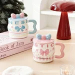 ⁦1Pc Random - 3D Pastel Ceramic Mug With Bow Lid - 400ml⁩ - الصورة ⁦3⁩